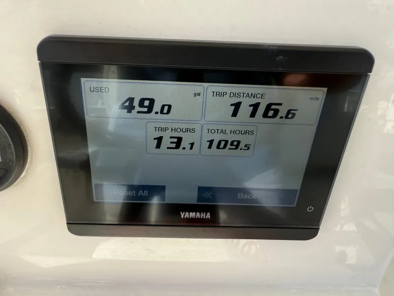 Slide: The Image of Yamaha display showing fuel usage, trip distance, and hours on a 2023 Pathfinder 2400 Open. - 14