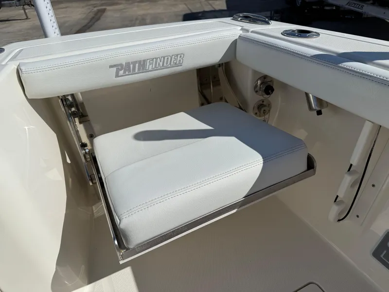 Slide: The Image of 2023 Pathfinder 2400 Open boat seat with white cushion and logo detail. - 16