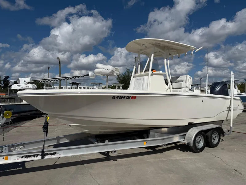 Slide: The Image of 2023 Pathfinder 2400 Open boat on trailer under cloudy sky. - 18