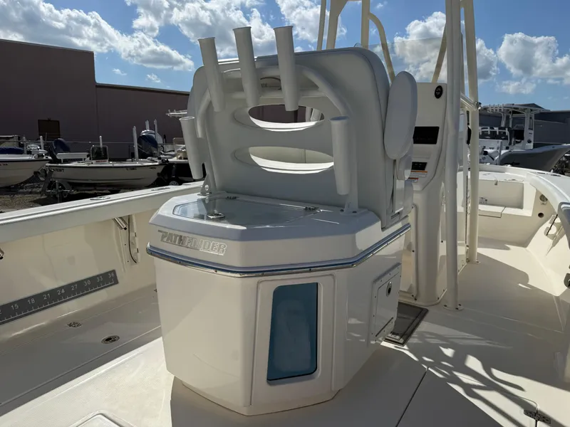 Slide: The Image of 2023 Pathfinder 2400 Open boat interior with rod holders and storage compartments. - 6