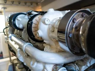 Slide: The Image of Engine of a 1999 Viking Express boat, showcasing intricate mechanical components. - 2