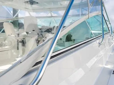 Slide: The Image of 1999 Viking Express boat interior with sleek white design and modern seating. - 20