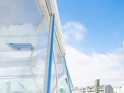 Slide: The Image of Side view of a 1999 Viking Express boat against a clear blue sky. - 21