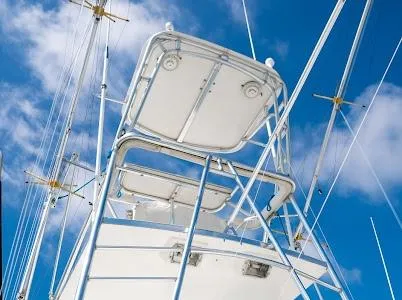 Slide: The Image of 1999 Viking Express boat tower against a blue sky with clouds. - 23
