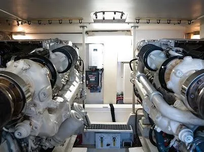 Slide: The Image of Engine room of a 1999 Viking Express boat, showcasing dual engines and mechanical components. - 3