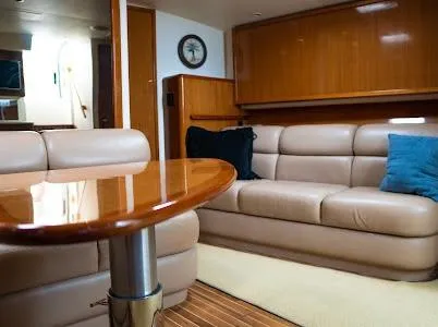Slide: The Image of Luxurious interior of a 1999 Viking Express yacht with leather seating and wooden accents. - 6