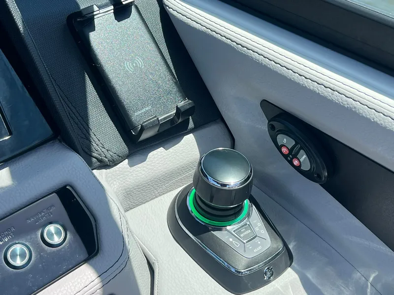 Slide: The Image of Control panel of 2022 Cobalt R8 Outboard boat with joystick and wireless charging pad. - 14