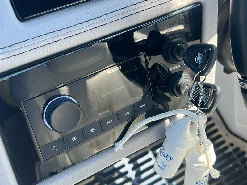 Slide: The Image of Control panel of 2022 Cobalt R8 Outboard with keys and audio system. - 15