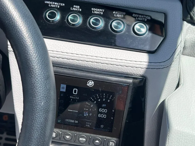 Slide: The Image of Dashboard of a 2022 Cobalt R8 Outboard boat with control panel and display. - 16