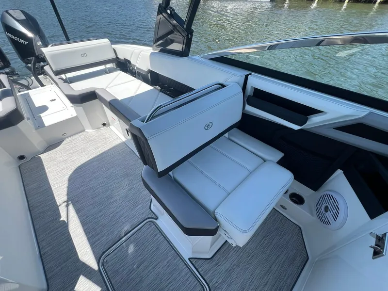 Slide: The Image of 2022 Cobalt R8 Outboard boat interior with white seating and modern design. - 20