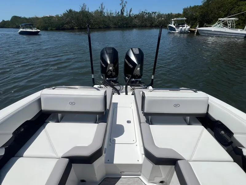 Slide: The Image of 2022 Cobalt R8 Outboard boat with dual engines on a calm lake. - 24