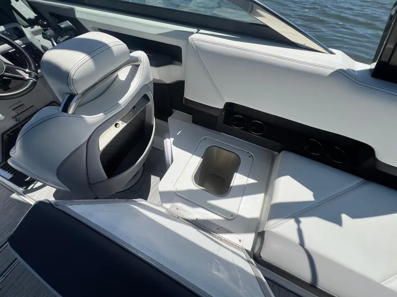 Slide: The Image of Interior of 2022 Cobalt R8 Outboard boat with sleek seating and storage compartment. - 26