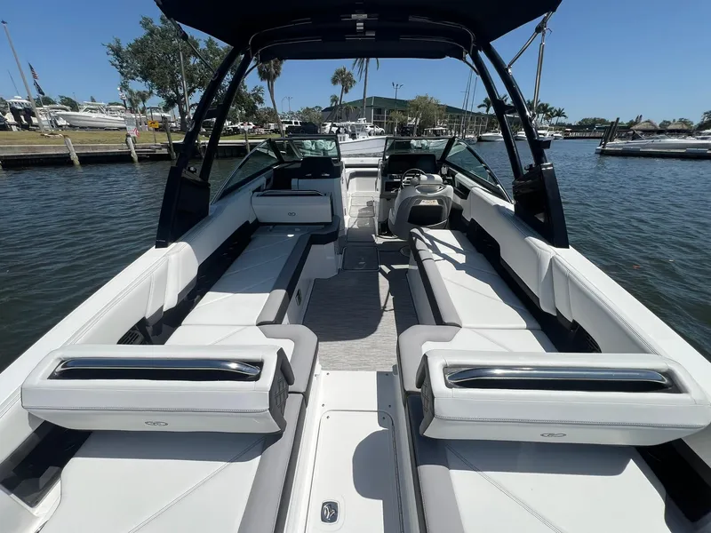 Slide: The Image of 2022 Cobalt R8 Outboard boat interior with sleek seating and modern design on a sunny day. - 30