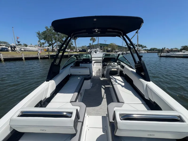Slide: The Image of 2022 Cobalt R8 Outboard boat with sleek interior, docked on a sunny day. - 31