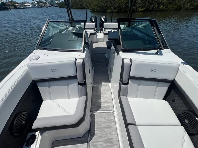 Slide: The Image of 2022 Cobalt R8 Outboard boat interior with sleek seating and modern design on a calm lake. - 8