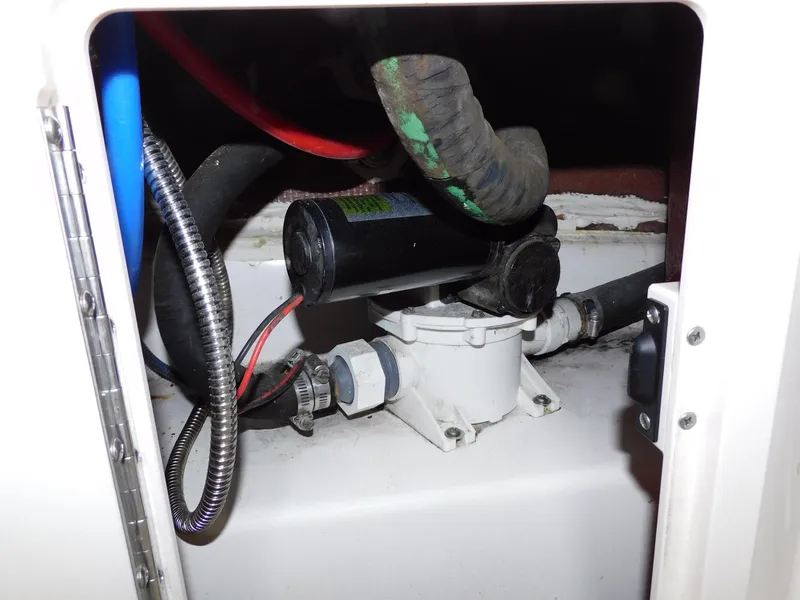 Slide: The Image of 2008 Robalo R305 Walkaround boat engine compartment with hoses and wiring. - 31