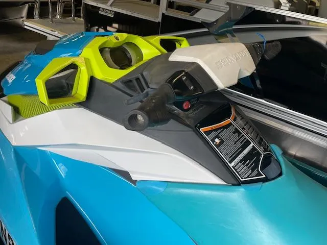 Slide: The Image of 2016 Sea-Doo GTI 130 SE jet ski with vibrant blue and yellow accents. - 6