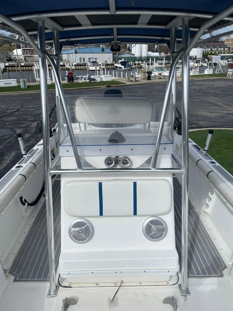 Slide: The Image of Edgewater 220CC 2000 model boat interior with seating and metal framework. - 11