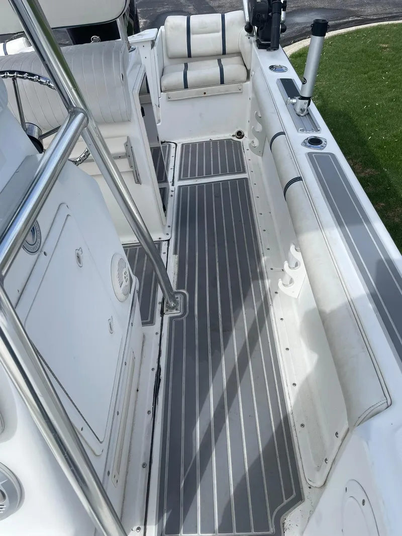Slide: The Image of Edgewater 220CC 2000 boat interior with sleek seating and modern design. - 12