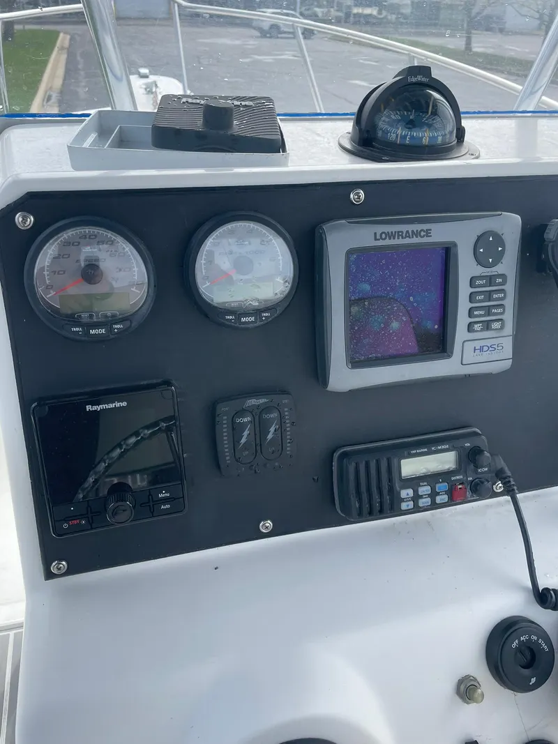 Slide: The Image of Edgewater 220CC 2000 boat dashboard with navigation instruments and controls. - 15