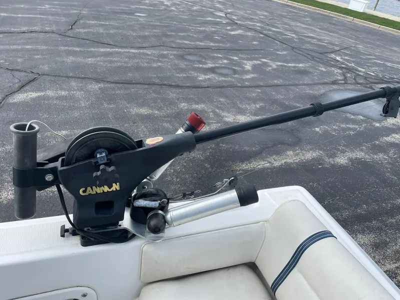 Slide: The Image of Edgewater 220CC 2000 boat with a mounted Cannon fishing rod holder. - 19