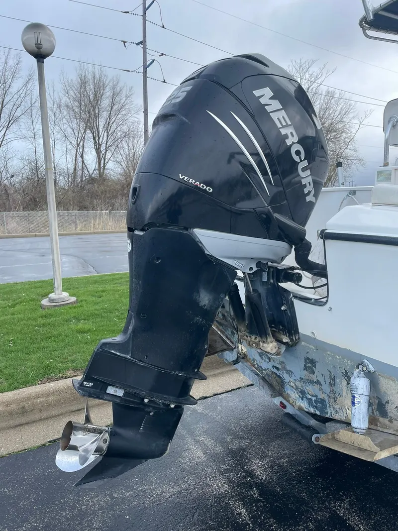 Slide: The Image of Edgewater 220CC 2000 boat with Mercury Verado outboard motor in parking lot. - 5