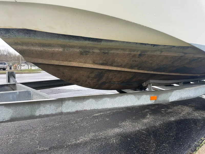 Slide: The Image of Underside of a 2000 Edgewater 220CC boat on a trailer. - 8