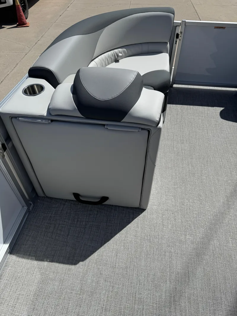 Slide: The Image of 2025 Tahoe Pontoon LTZ Quad Lounger with gray seating and cup holder on deck. - 13