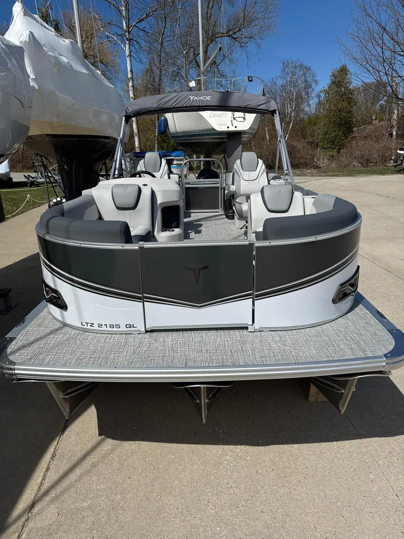 Slide: The Image of 2025 Tahoe Pontoon LTZ Quad Lounger, sleek design, spacious seating, outdoor setting. - 9