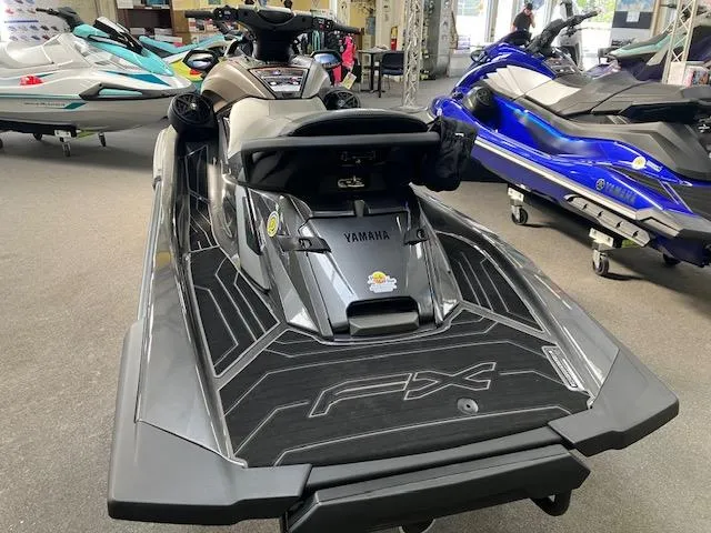 Slide: The Image of 2025 Yamaha WaveRunner FX HO in showroom, rear view, sleek design, gray color. - 10