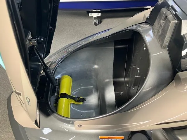 Slide: The Image of 2025 Yamaha WaveRunner FX HO storage compartment with open lid, showcasing interior space. - 8