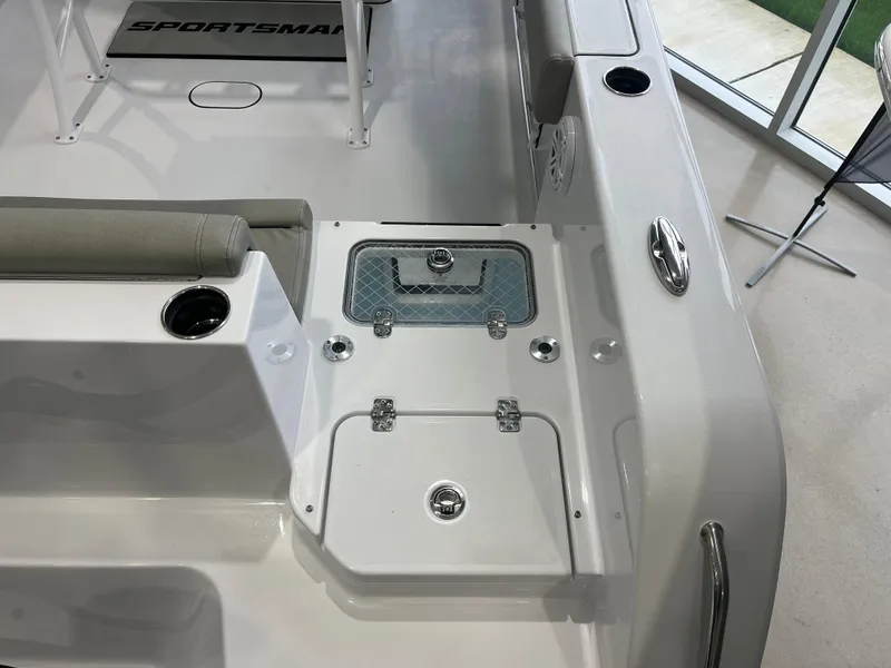 Slide: The Image of 2025 Sportsman Heritage 231 Center Console boat interior with seating and storage compartments. - 13