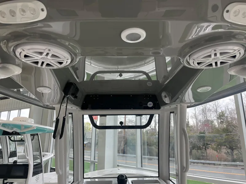 Slide: The Image of 2025 Sportsman Heritage 231 Center Console interior with speakers and control panel. - 16