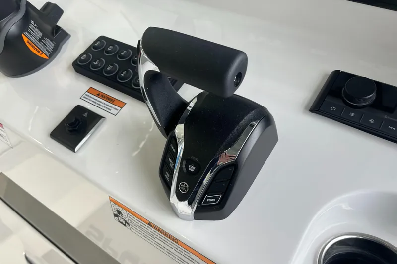 Slide: The Image of 2025 Sportsman Heritage 231 Center Console throttle control on sleek dashboard. - 17