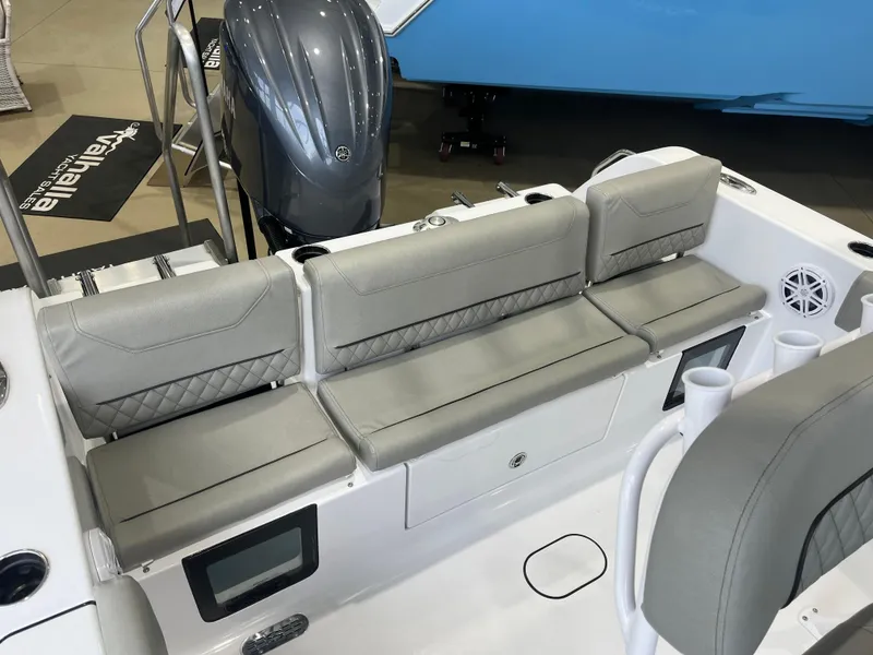 Slide: The Image of 2025 Sportsman Heritage 231 Center Console boat with gray seating and modern design. - 3