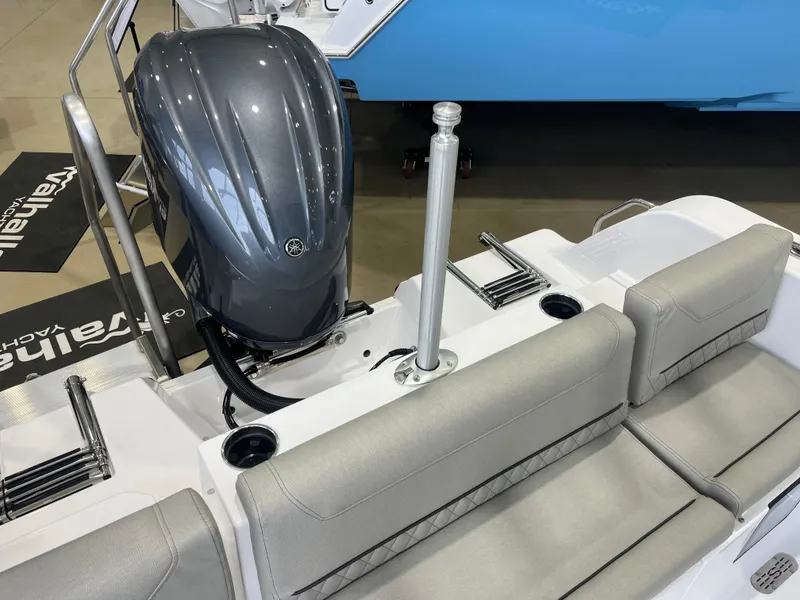 Slide: The Image of 2025 Sportsman Heritage 231 Center Console boat with sleek engine and comfortable seating. - 5