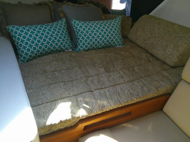 Slide: The Image of Cozy interior of 2009 Everglades 350LX with patterned bedding and decorative pillows. - 19