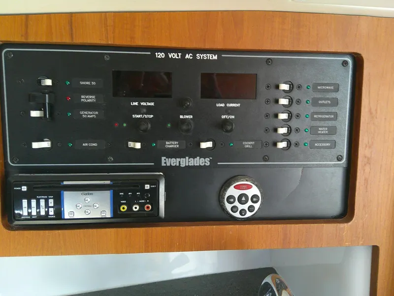 Slide: The Image of Control panel of a 2009 Everglades 350LX boat with 120V AC system. - 23