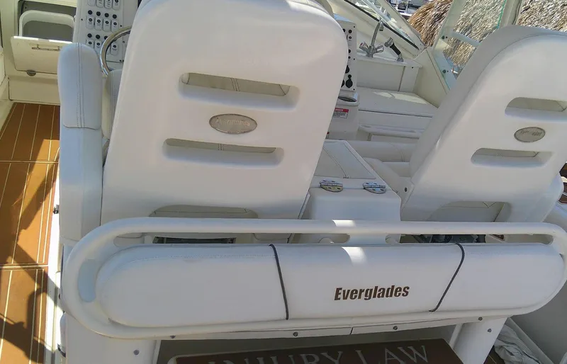 Slide: The Image of 2009 Everglades 350LX boat interior with white seating and control panel. - 24