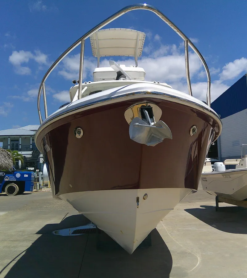 Slide: The Image of 2009 Everglades 350LX boat docked under clear blue sky. - 5