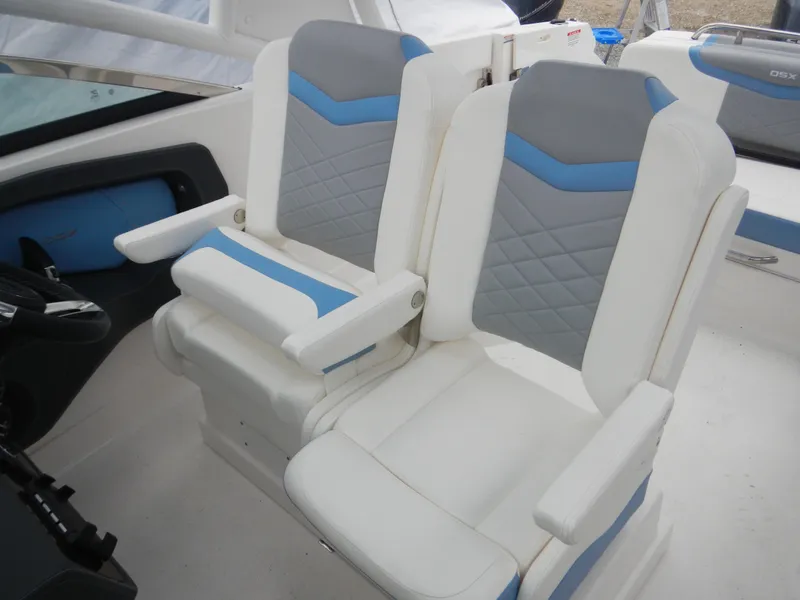 Slide: The Image of 2022 Chaparral 280 OSX boat seats with white, gray, and blue upholstery. - 15