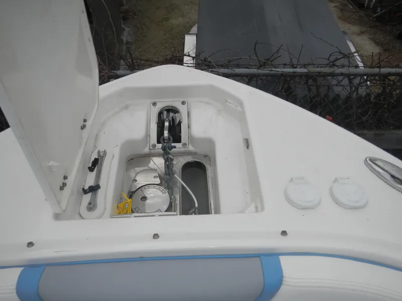 Slide: The Image of 2022 Chaparral 280 OSX boat anchor compartment with open hatch. - 7