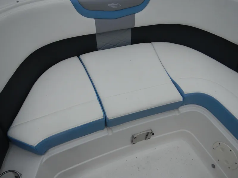 Slide: The Image of 2022 Chaparral 280 OSX boat interior seating with white and blue cushions. - 9