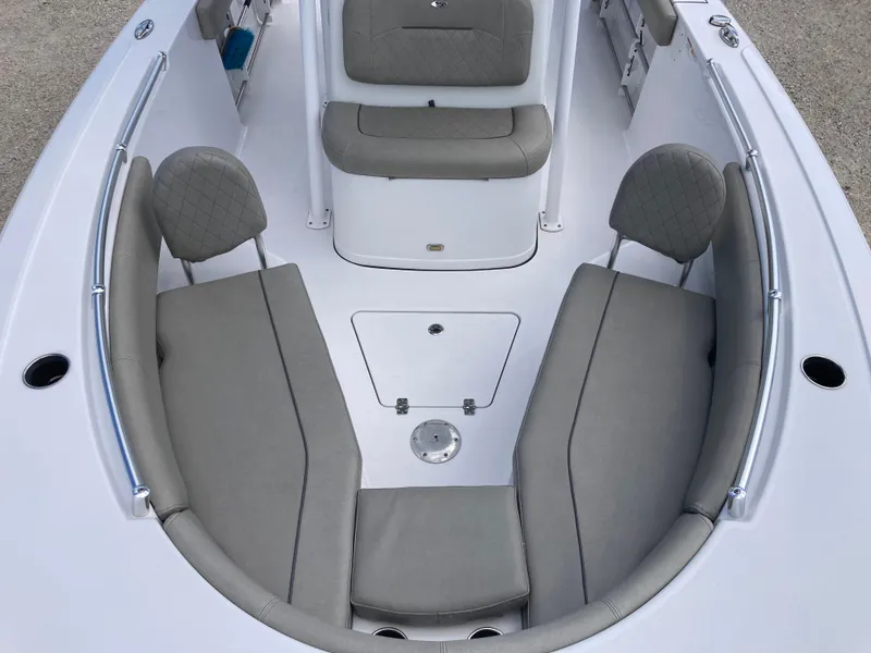 Slide: The Image of 2022 Sportsman 241 Heritage boat interior with gray seating and storage compartments. - 11