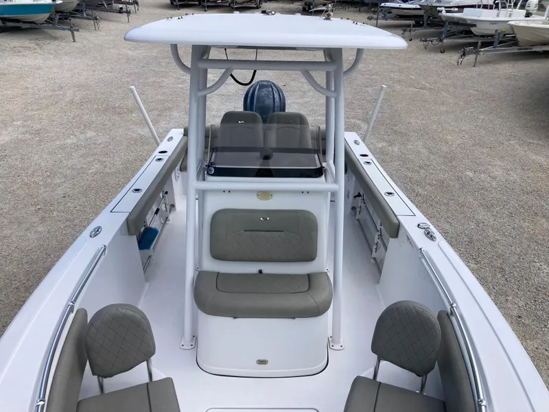 Slide: The Image of 2022 Sportsman 241 Heritage boat with seating and console, displayed outdoors. - 12