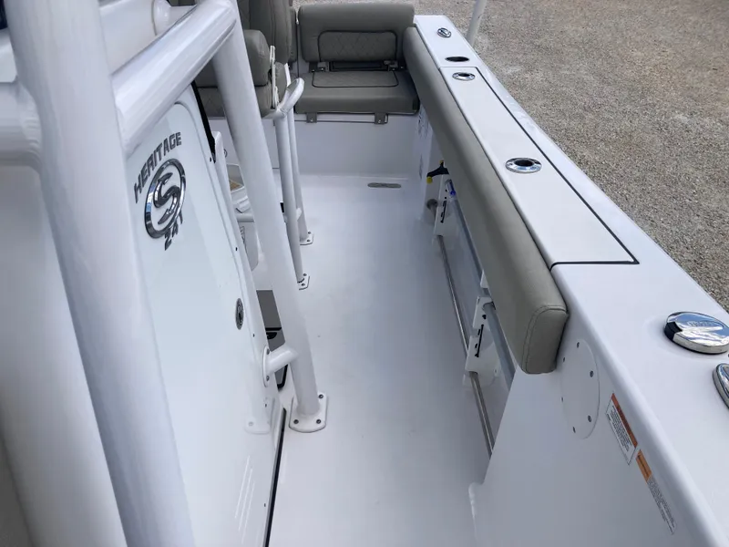 Slide: The Image of 2022 Sportsman 241 Heritage boat interior with seating and storage compartments. - 14