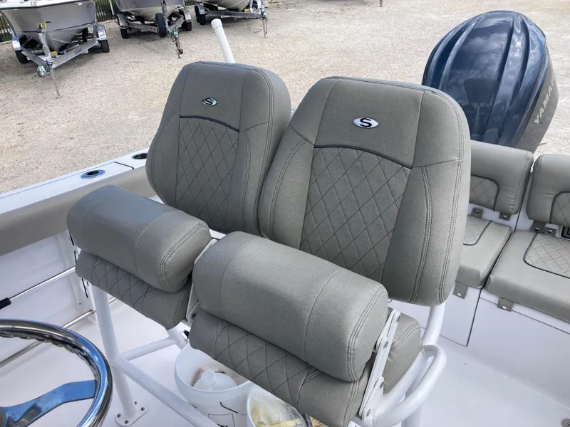 Slide: The Image of 2022 Sportsman 241 Heritage boat seats with diamond stitching and armrests. - 17