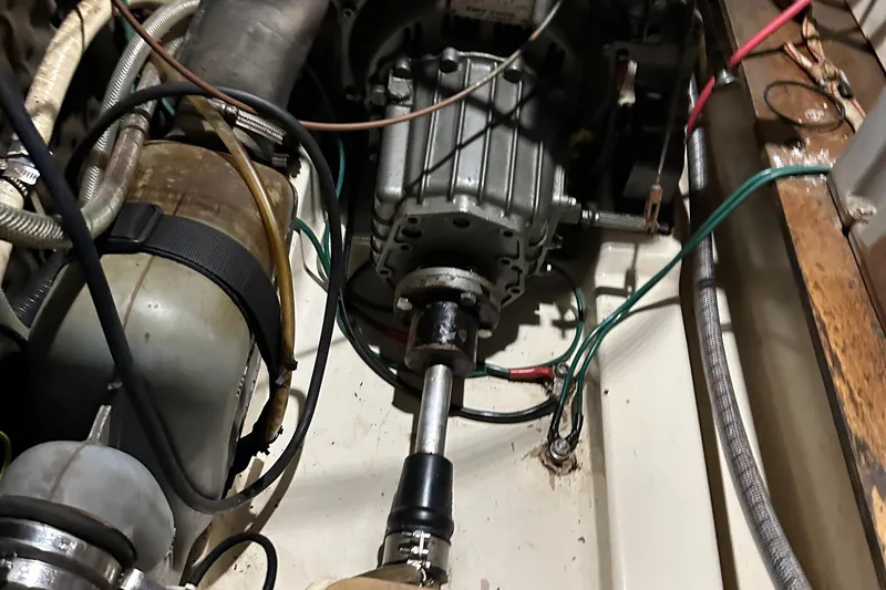 Slide: The Image of Engine compartment of a 1999 Beneteau Oceanis 400 sailboat, showing mechanical components and wiring. - 24