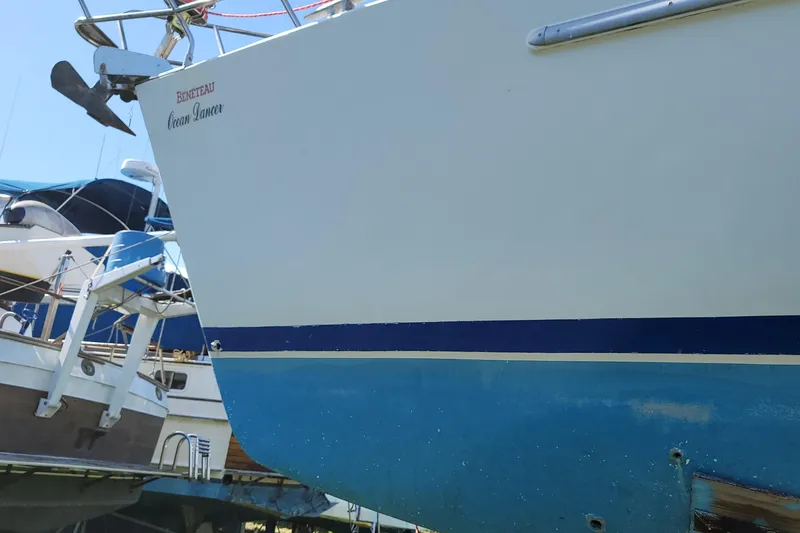 Slide: The Image of 1999 Beneteau Oceanis 40CC sailboat on dry dock, showing hull and anchor. - 27