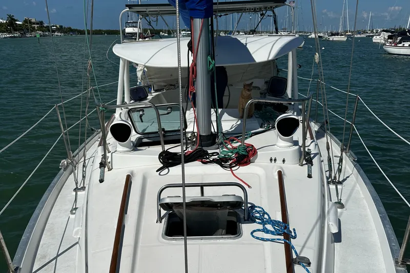 Slide: The Image of 1999 Beneteau Oceanis 40CC sailboat on calm water, featuring deck and rigging details. - 3